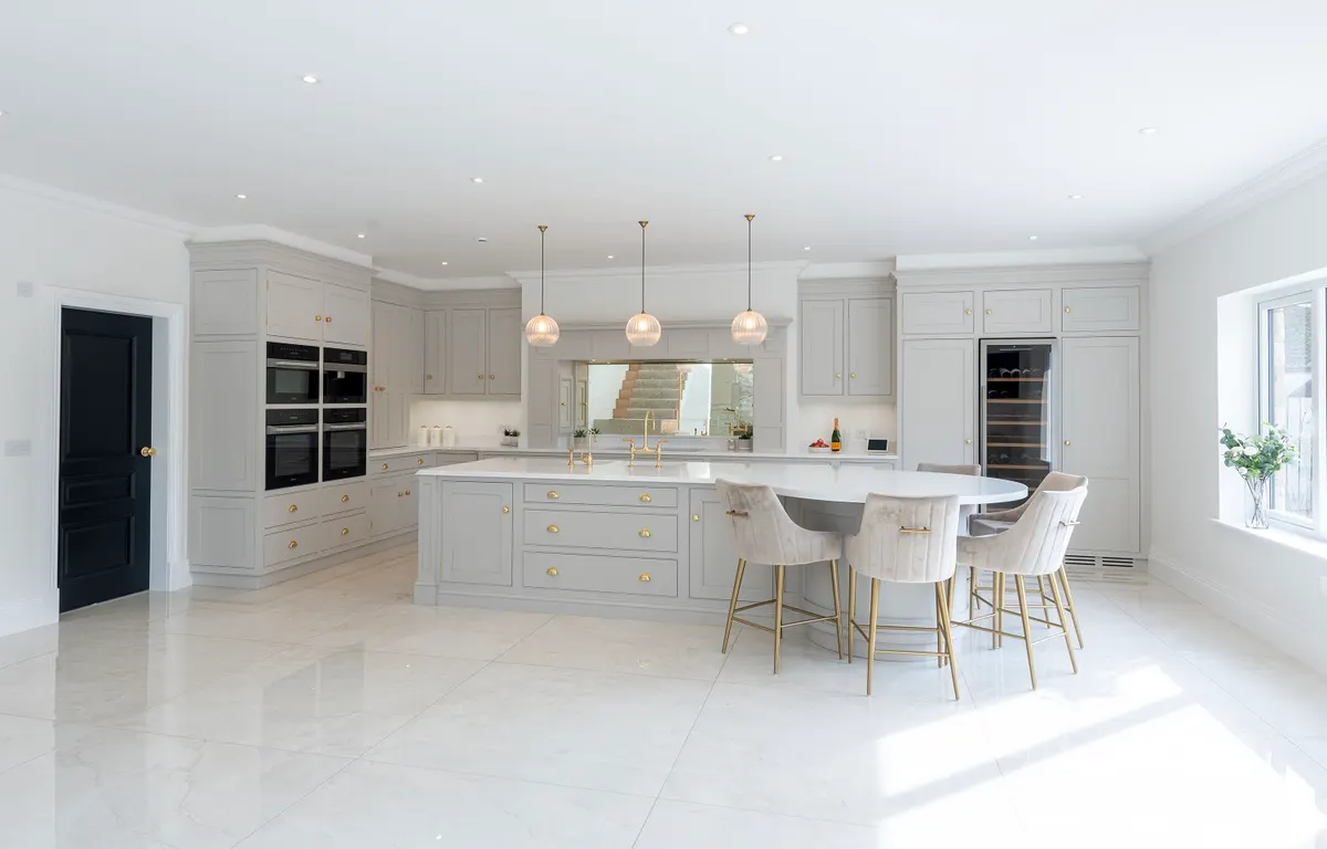 The Dornock island from the far side, tall cabinets and double ovens along the back wall